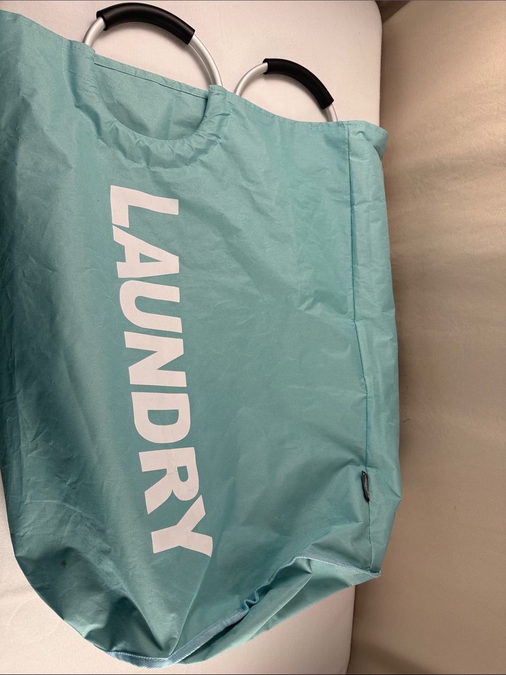 Lightly used laundry bag with handles
